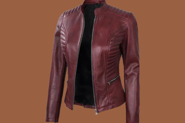 Women’s maroon leather café‑racer jacket with stand collar and front zip — genuine leather outerwear for women.